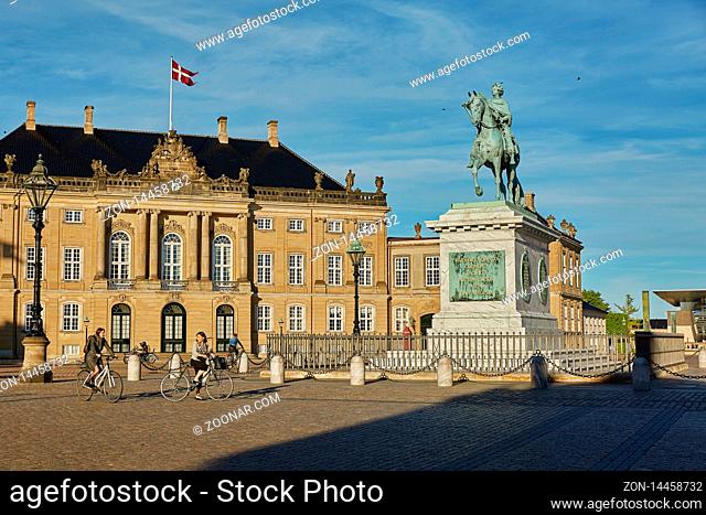 COPENHAGEN, DENMARK - MAY 25, 2017: Amalienborg is the residence of the Danish Royal Family. The palace is octagonal with a statue of King Frederik V in centre