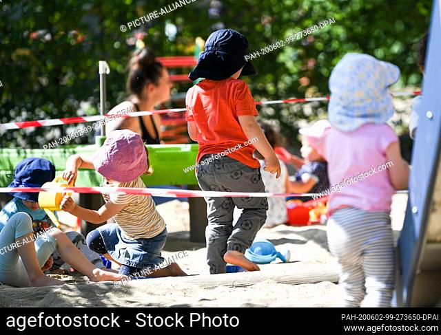 02 June 2020, Hessen, Offenbach/Main: Children of the nursery group ""Rainbow Fish"" play on the playground of the nursery at the Offenbach Sana Hospital