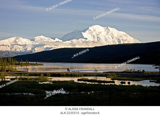 Bicyclists And Hikers View Mt. Mckinley At Wonder Lake, Denali National Park And Preserve, Interior Alaska, Summer