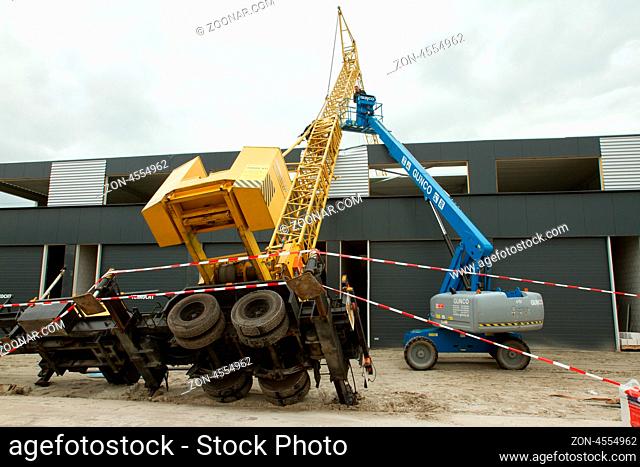 LEEUWARDEN, FRIESLAND, HOLLAND-JUNE 1: Mobile tower crane has collapsed on top of a building. June 1, 2012, Friesland, Holland