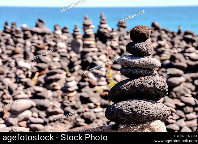 Photo Picture Stack of stones on the sea beach