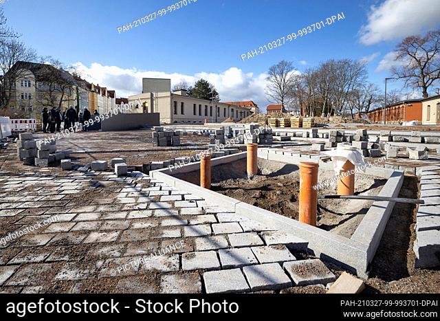 27 March 2021, Thuringia, Erfurt: Bodo Ramelow (Left), Thuringia's Minister President, looks at the new facility under construction at the Old Garrison Hospital...