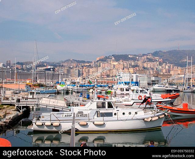 GENOA, ITALY - MARCH 16, 2014: Since the construction of the new harbour for merchant ships, the old harbour called Porto Vecchio is still in use for cruise...