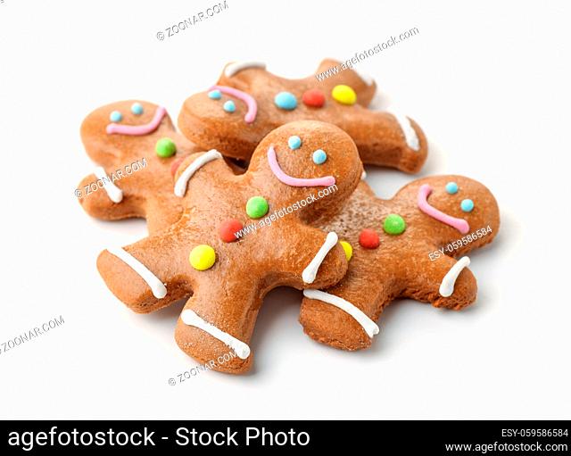 Pile of gingerbread men isolated on white