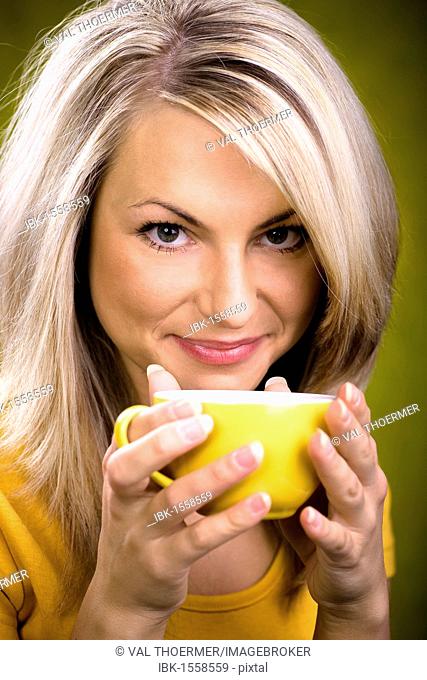 Young woman holding a teacup