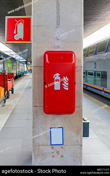 Fire Extinguisher in Box at Train Station Platform