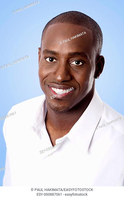 Happy smiling face of a handsome African American business man wearing a white shirt, isolated