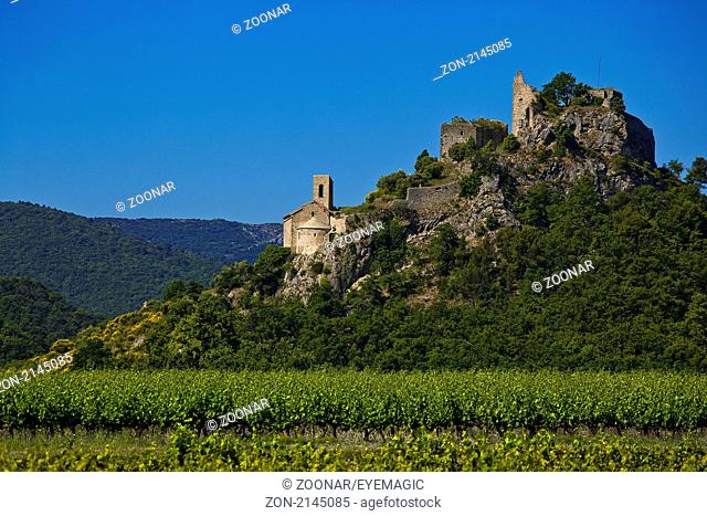 ruins of Entrechaux castle overlooking vineyards of Côtes du Ventoux region, Vaucluse, Provence, France