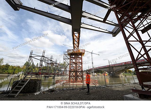 A construction worker stands on the construction site of the Neckar bridge in Stuttgart, Germany, 4 October 2017. When finished