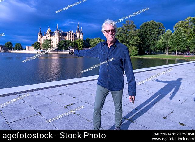 14 July 2022, Mecklenburg-Western Pomerania, Schwerin: Drummer and composer Stewart Copeland stands next to the open air stage in front of Schwerin Castle...