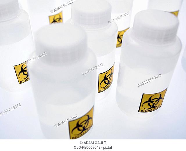 Biohazard labels on plastic bottles