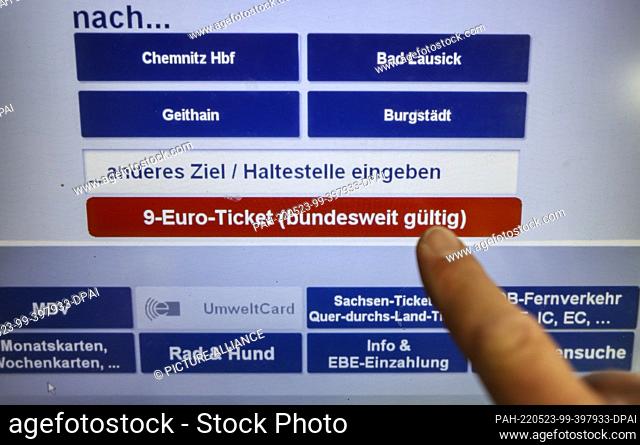 23 May 2022, Saxony, Leipzig: A man buys a 9-euro ticket at the ticket machine of the Mitteldeutsche Regiobahn (MRB). People in Saxony will be able to buy the...