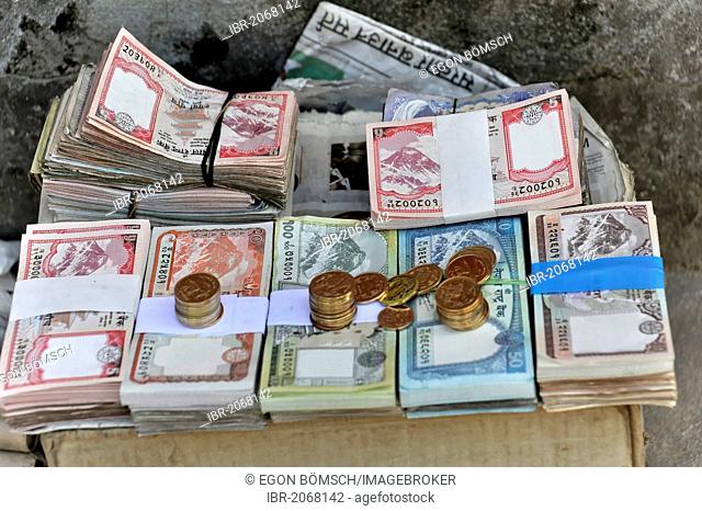 Banknotes on a street vendor's stall, Kathmandu, Kathmandu Valley, Nepal, Asia