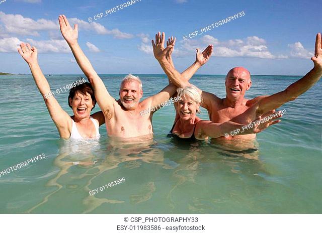 Retired people swimming in the ocean