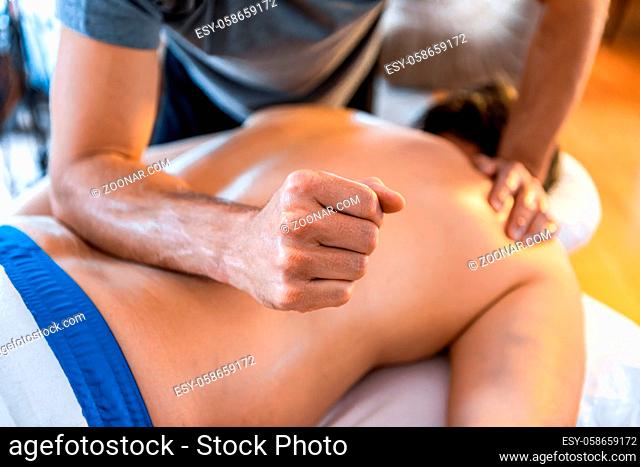 Sports massage therapy in the medical clinic. Therapeutic body massage treatment. Sports injury rehabilitation concepts
