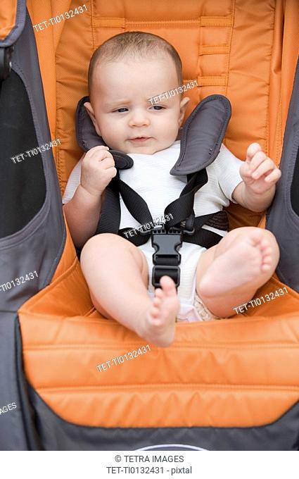 Close up of baby boy in stroller