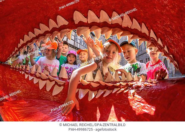 Kindergarten children look at a replica jaw of an extinct Megalodon shark at the natural history museum at Bertholdsburg Palace in Schleusingen, Germany