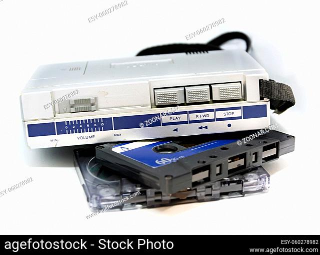 Old portable stereo audio tape cassette player isolated on a white background. Obsolete technology. 80s. Listening to music
