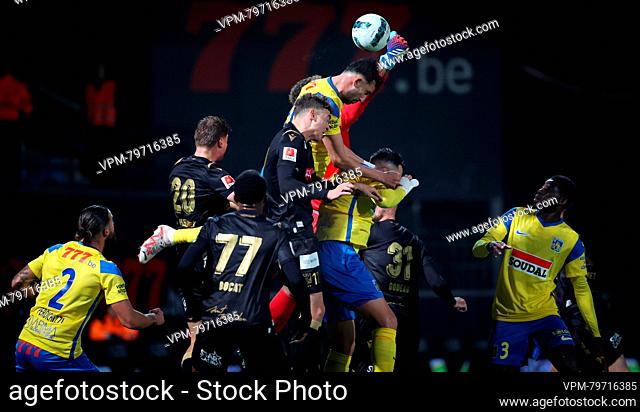 STVV's goalkeeper Zion Suzuki and Westerlo's Emin Bayram fight for the ball during a soccer match between KVC Westerlo and Sint-Truidense VV