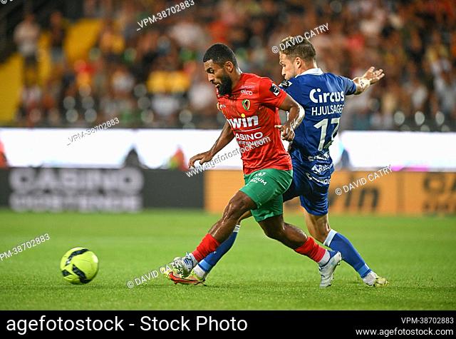 Oostende's Theo Matam Ndicka and Gent's Andrew Hjulsager fight for the ball during a soccer match between KV Oostende and KAA Gent