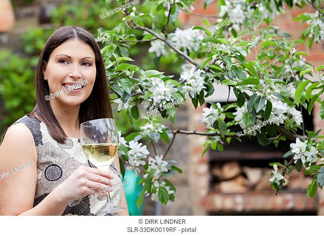 Woman drinking wine outdoors