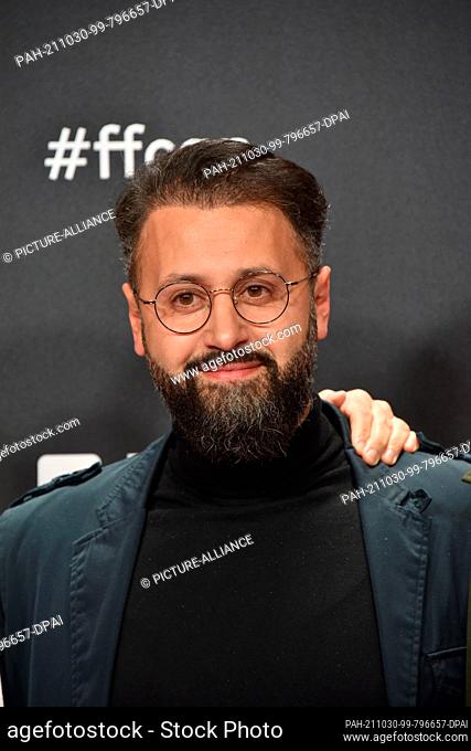 27 October 2021, North Rhine-Westphalia, Cologne: Actor Eddy Cheaib arrives for the screening of the film Westwall as part of the Film Festival Cologne