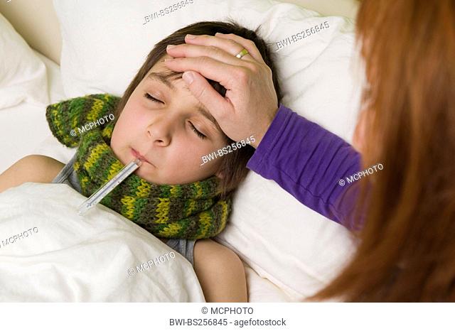 mother with her sick at the bed
