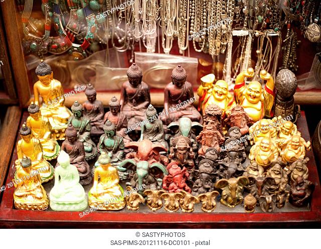 Figurines of Buddha for sale at souvenir shop, Tibetan Market, Delhi, India