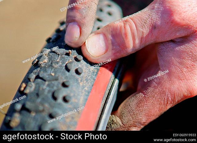 pecking repairing Bicycle tyre, Bicycle wheel punctured