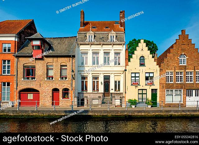 Bruges typical Belgian cityscape Europe tourism concept - canal and old Flemish houses. Brugge, Belgium