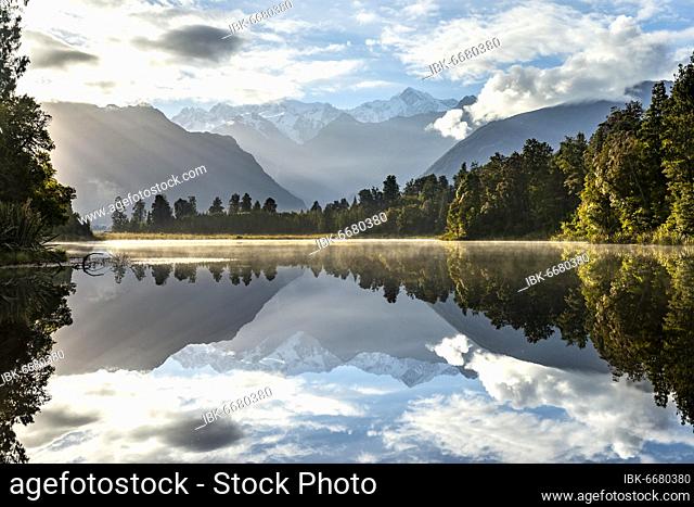 View of Mount Cook and Mount Tasman in morning light, reflection in Lake Matheson, Westland National Park, New Zealand Alps, West Coast Region, South Island