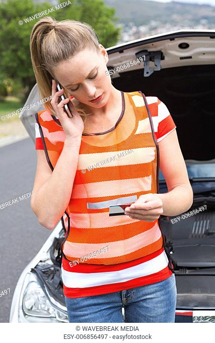 Young woman calling with her mobile phone