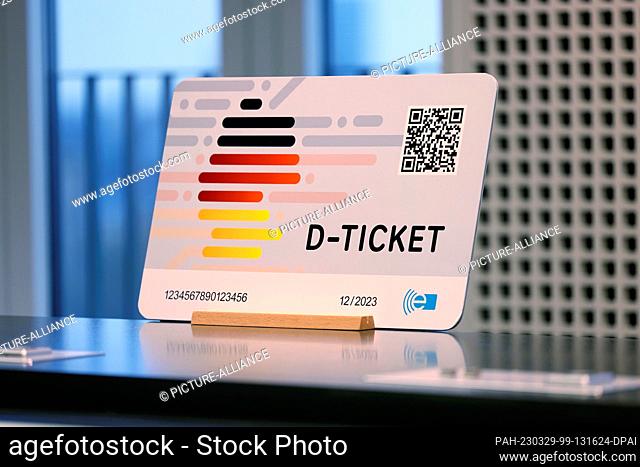 29 March 2023, North Rhine-Westphalia, Duesseldorf: An oversized model of the new Deutschlandticket is presented at a press conference