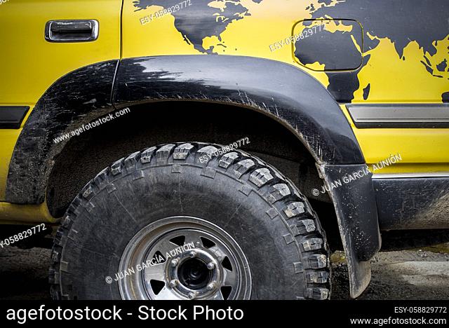 World traveller off road vehicle. A world map is painted over rear wheel