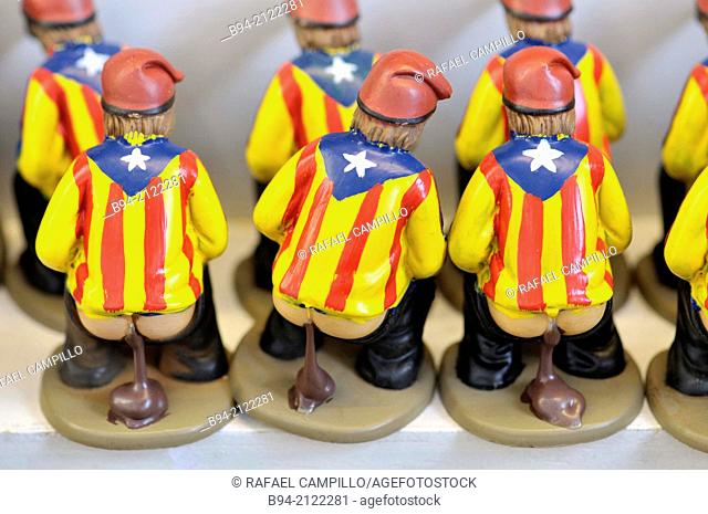 'Caganers', particular feature of modern nativity scenes at Santa Llucia Christmas fair, Barcelona. Catalonia, Spain