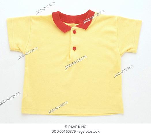 A yellow child's top with a red collar
