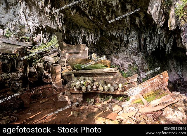 The spectacular cave tomb of Lombok Parinding which has housed the dead of Tana Toraja since 700 years. The tomb is famous for its ancient, ornate coffins