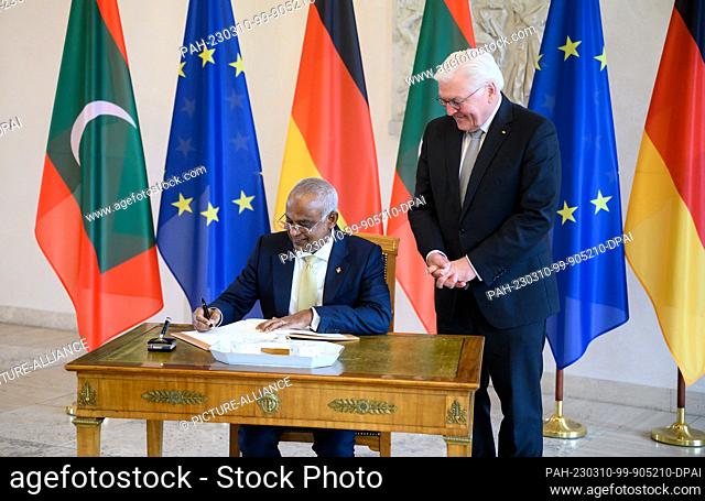 10 March 2023, Berlin: Ibrahim Mohamed Solih (l), President of the Republic of Maldives, signs the guest book before his meeting with German President...