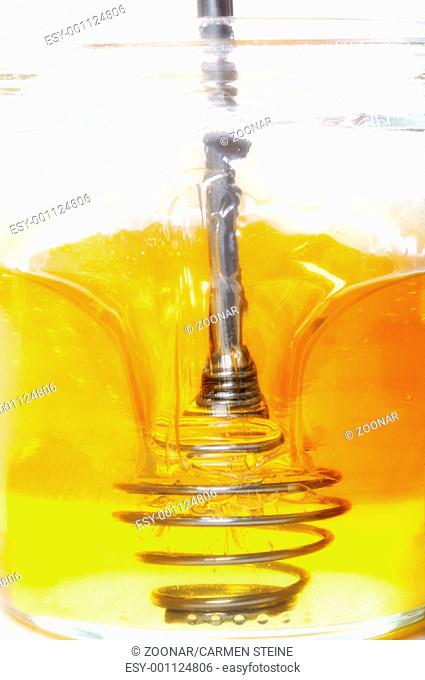 Honey in jar with scoop