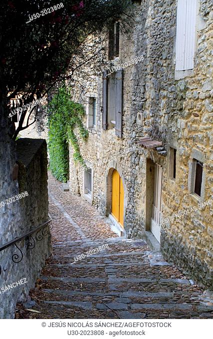 Typical paved street in Roque-sur-Ceze, labelled The Most Beautiful Villages of France. Gard deparment, Languedoc-Roussillon region. France