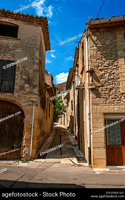 Street view with stone houses in the city center of Chateauneuf-du-Pape hamlet. Near Avignon, Vaucluse department, Provence region, southeastern France