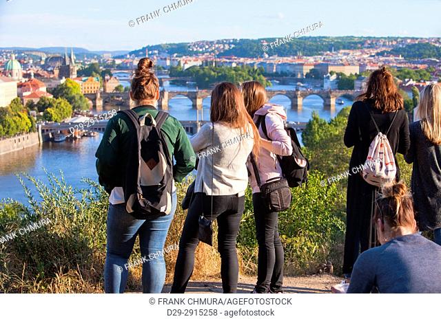 Czech Republic, Prague - Tourists admiring view of bridges over Vltava river