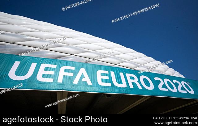 11 June 2021, Bavaria, Munich: A banner with the inscription ""UEFA Euro 2020"" hangs in front of the Allianz Arena. On 15.06