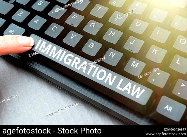 Sign displaying Immigration Law, Business overview Emigration of a citizen shall be lawful in making of travel Typing New Blog Contents, Writing Movie Scripts