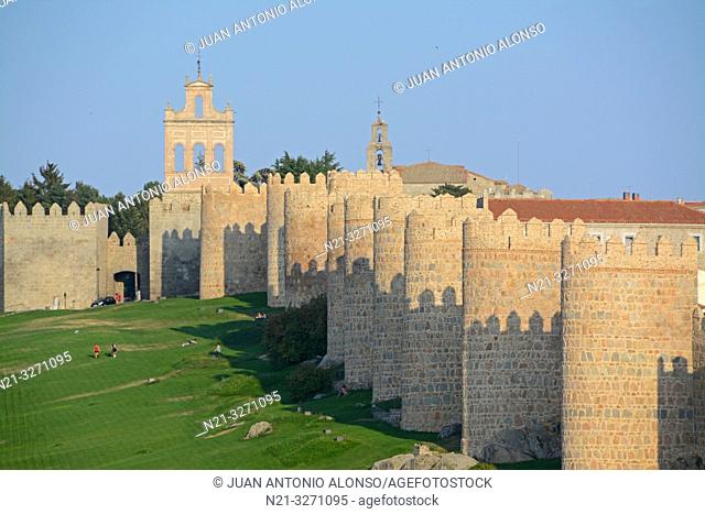 The Espadaña -bell gable- on the left and the walls of the fortified city of Avila, Castilla-Leon, Spain, Europe