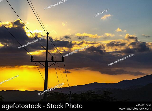 Electricity poles in the tropical nature of Topes de Collantes during sunset, Trinidad, Republic of Cuba, Caribbean, Central America
