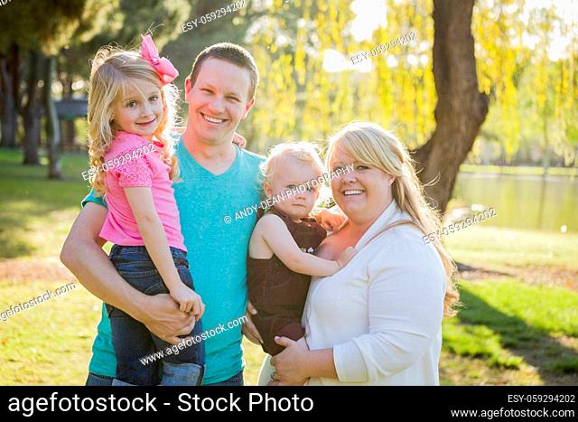 Young Attractive Family Portrait Enjoying the Park