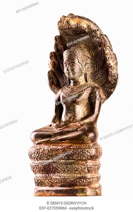 Buddha in a meditation pose, under protection of the king of nag - Mukalinda. Figure isolated on a white background