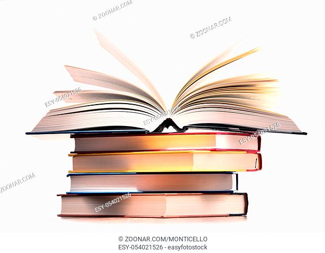 Composition with stack of books isolated on white