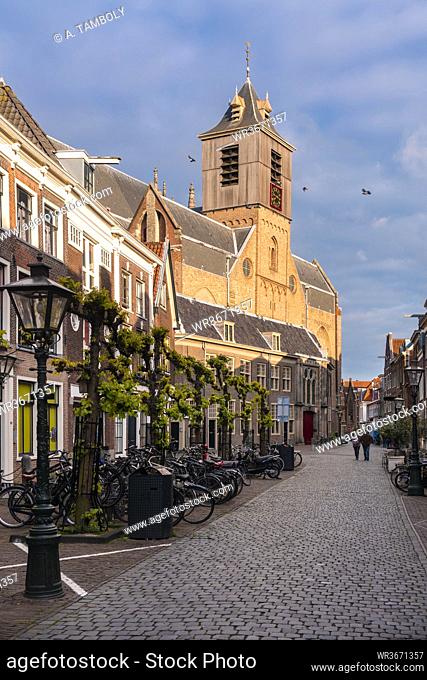 Netherlands, South Holland, Leiden, Cobblestone street in front of Hooglandse Kerk cathedral